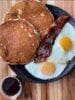 Trifecta Brunch Special! 2 of our famous pancakes, 2 strips of organic bacon, 2 fried eggs