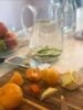Preparing Fresh juice from Limes and Oranges