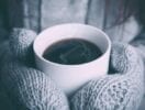 Coffee on a cold day - Coffee cup held by a person wearing mittens
