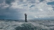 Stress - man drowning in the ocean - Organic Krush